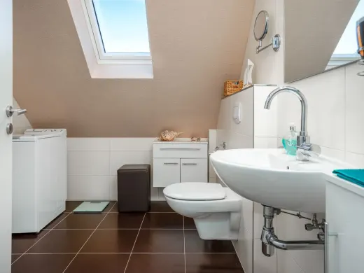 Bright bathroom with washing machine